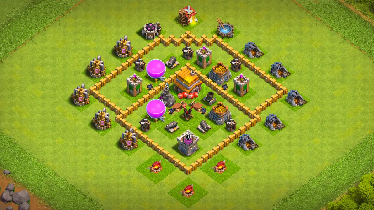 TH5 farming base with two wide sections, grouped core defenses, Spring Traps stopping Giants, and Air Bombs handling Balloon clusters.