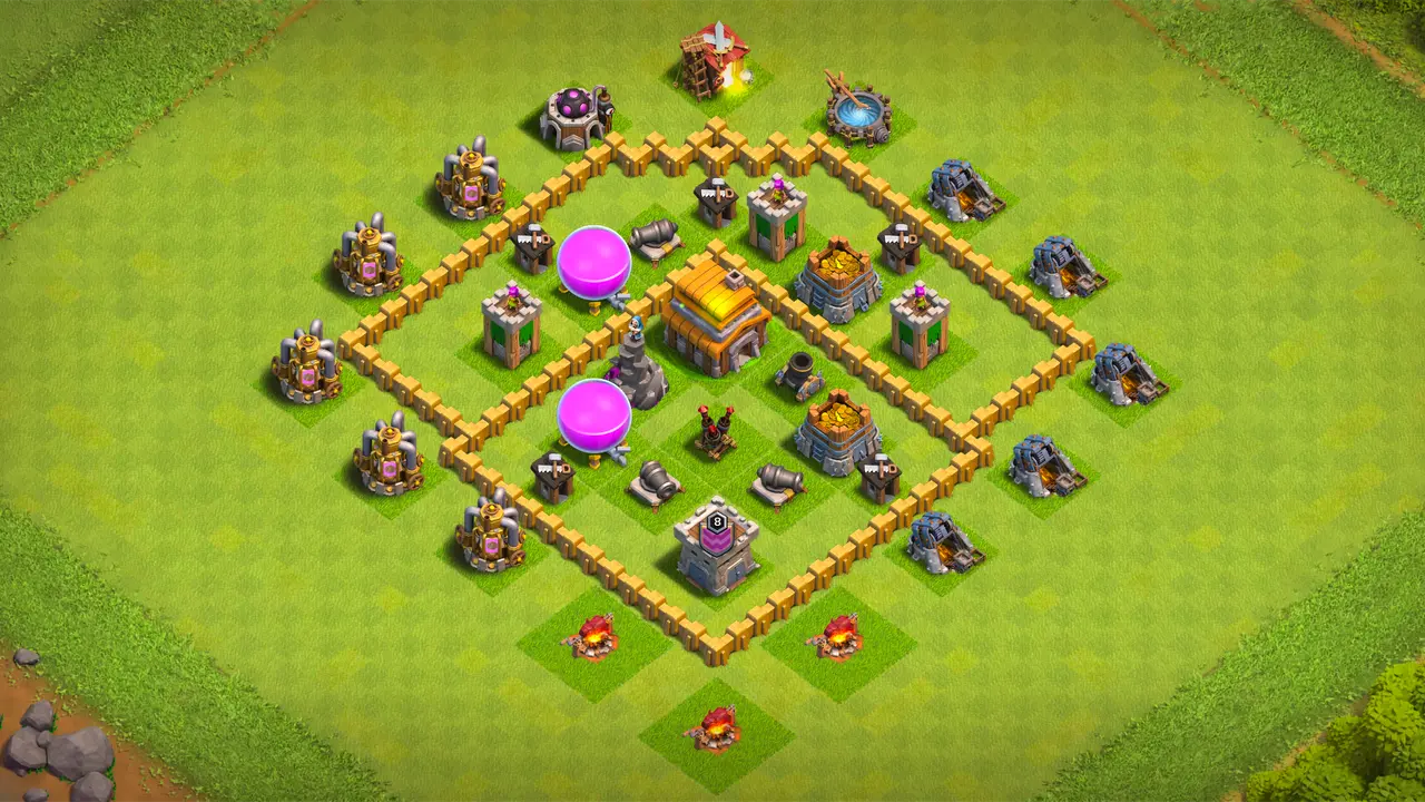 TH5 farming base with two wide sections, grouped core defenses, Spring Traps stopping Giants, and Air Bombs handling Balloon clusters. scout view - full base layout for clash of clans town hall 5
