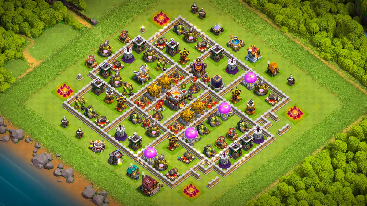TH11 farming base scout view in Clash of Clans with all collectors inside the walls, core defenses to stop Electro Dragons.