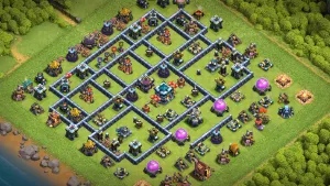 TH13 Anti-2 Trophy Base layout with box design, grouped heroes on the back side, wide Inferno sections, and trap setup to stop push hits and protect trophies.