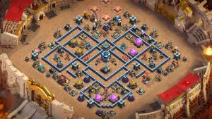 TH13 Anti-2 War Base layout with diamond shape, dead zones, isolated Town Hall and Eagle Artillery, and three Multi Infernos for strong anti-2 defense.