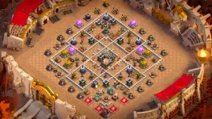 TH11 Anti-2 war base layout in Clash of Clans with the Eagle Artillery in the core, Hero Hunter and Inferno Towers to stop Queen Charge attacks.