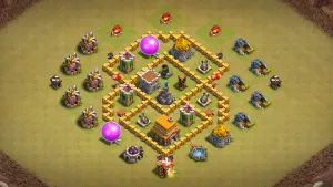 TH5 Anti-3 CWL base layout in Clash of Clans with open compartments, core Wizard Tower and Spring Traps to stop Giant and Wall Breaker pushes.
