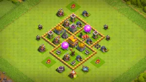 TH5 Anti-2 farming base layout in Clash of Clans with storages inside walls, Spring Traps and centered Air Defense to stop Giant Balloon pushes.