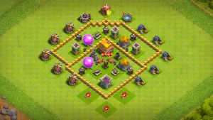 TH5 Anti-2 farming base layout in Clash of Clans with clustered core defenses, Spring Traps and Red Air Bombs to stop Giant Balloon raids.