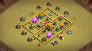 TH5 Anti-2 war base layout in Clash of Clans with Town Hall and Clan Castle locked in the core, box-style walls to stop ground attacks.